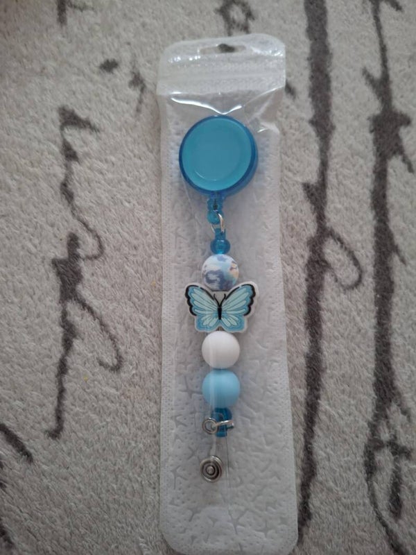 Badge met vlinder