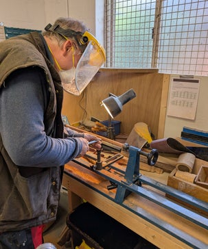 Ray: Checking that he's drilled in the correct area to a piece of wood.