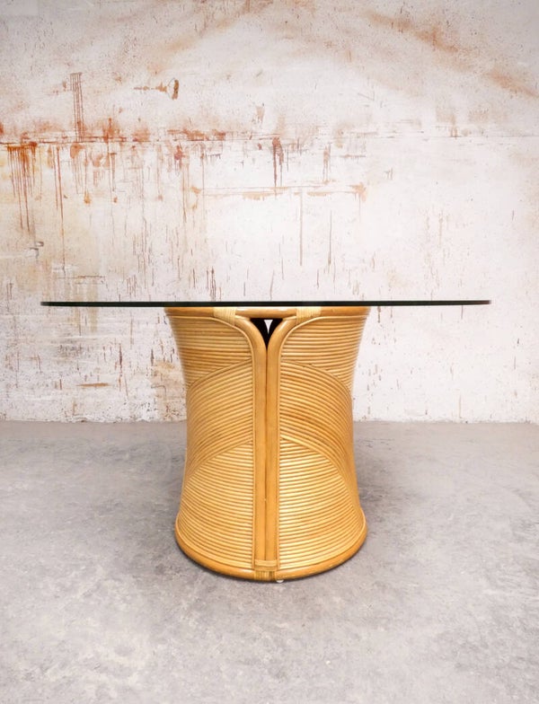 Round rattan and glass dining table