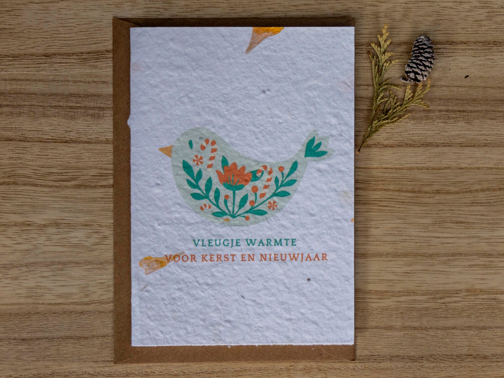 Kerstkaart op bloeipapier - Vogeltje met kleuren