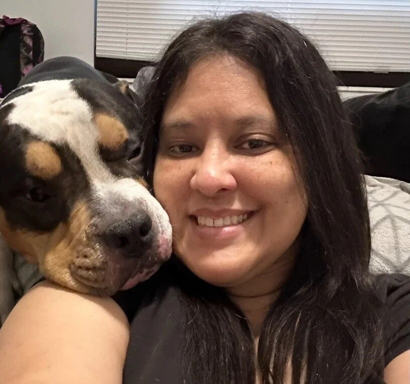 Danielle veterinary technician at Paws Bay Animal Hospital in Tampa, FL with her dog