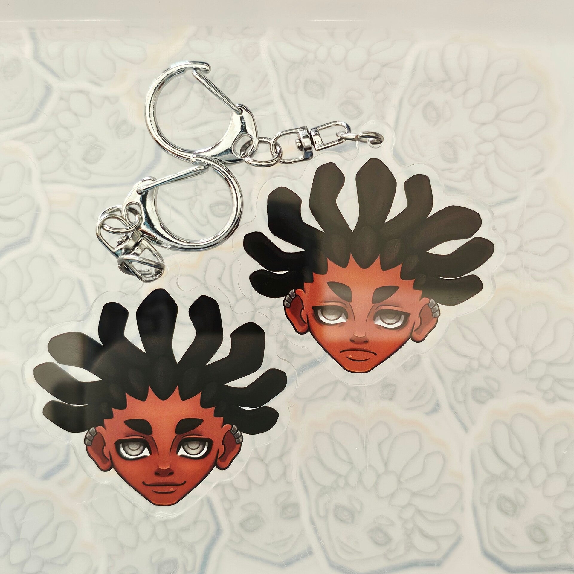 Arkha double-sided keychain