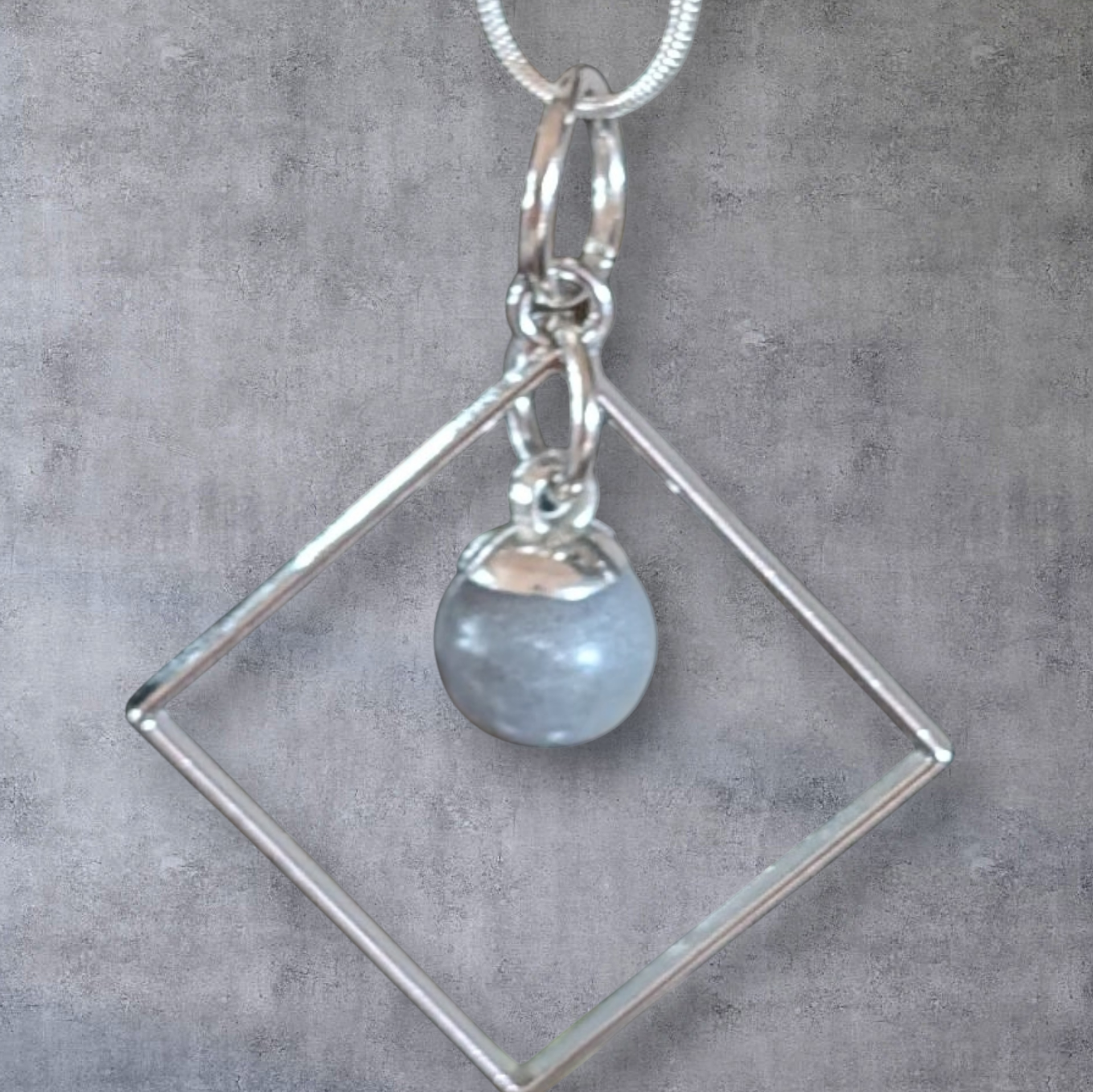 Betonschmuck Perle silberner Rahmen "Unikat"