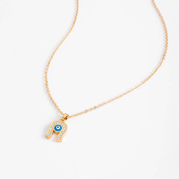 Gold plated charm necklace with blue enamel and crystal tone stones