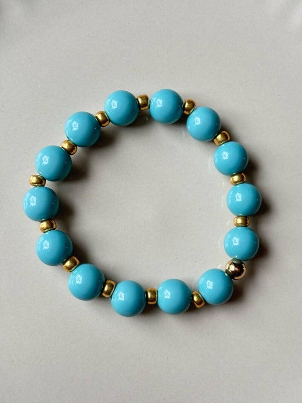 Turquoise armband met goud