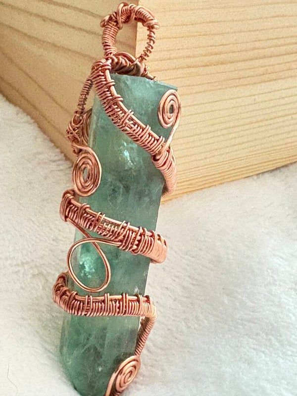 Cooper wire wrapped emerald prism gemstone