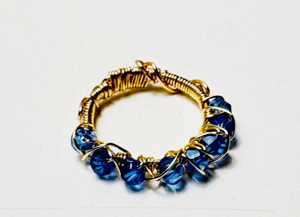 Gold wire wrapped blue Swarovski crystal ring