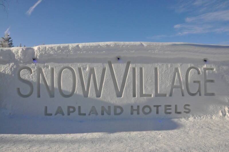 Sign for SnowVillage Lapland Hotels, welcoming guests to a magical winter experience in the heart of Lapland.
