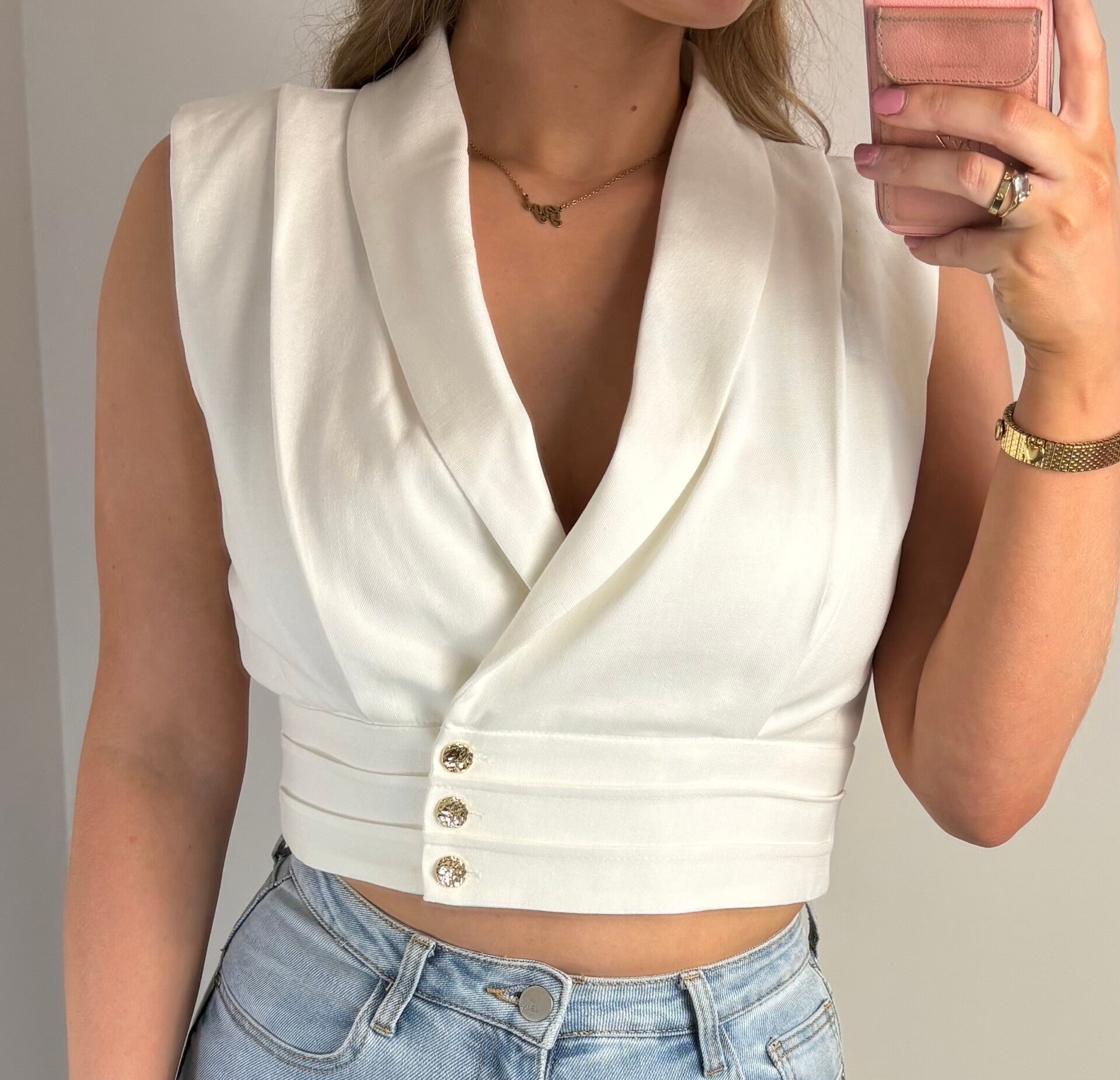 Sleeveless blazer top wit