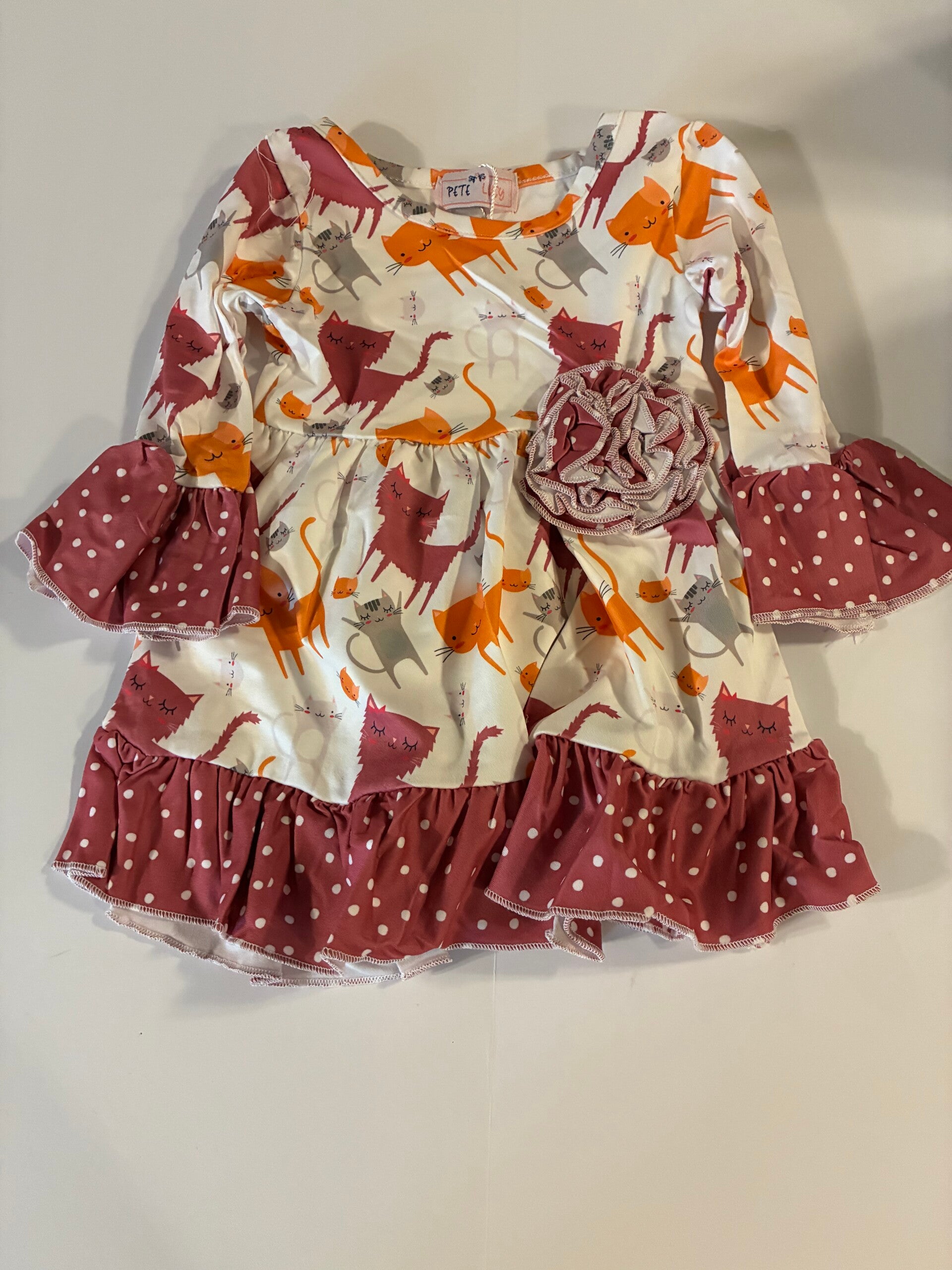 Infant dress with cats and ruffles