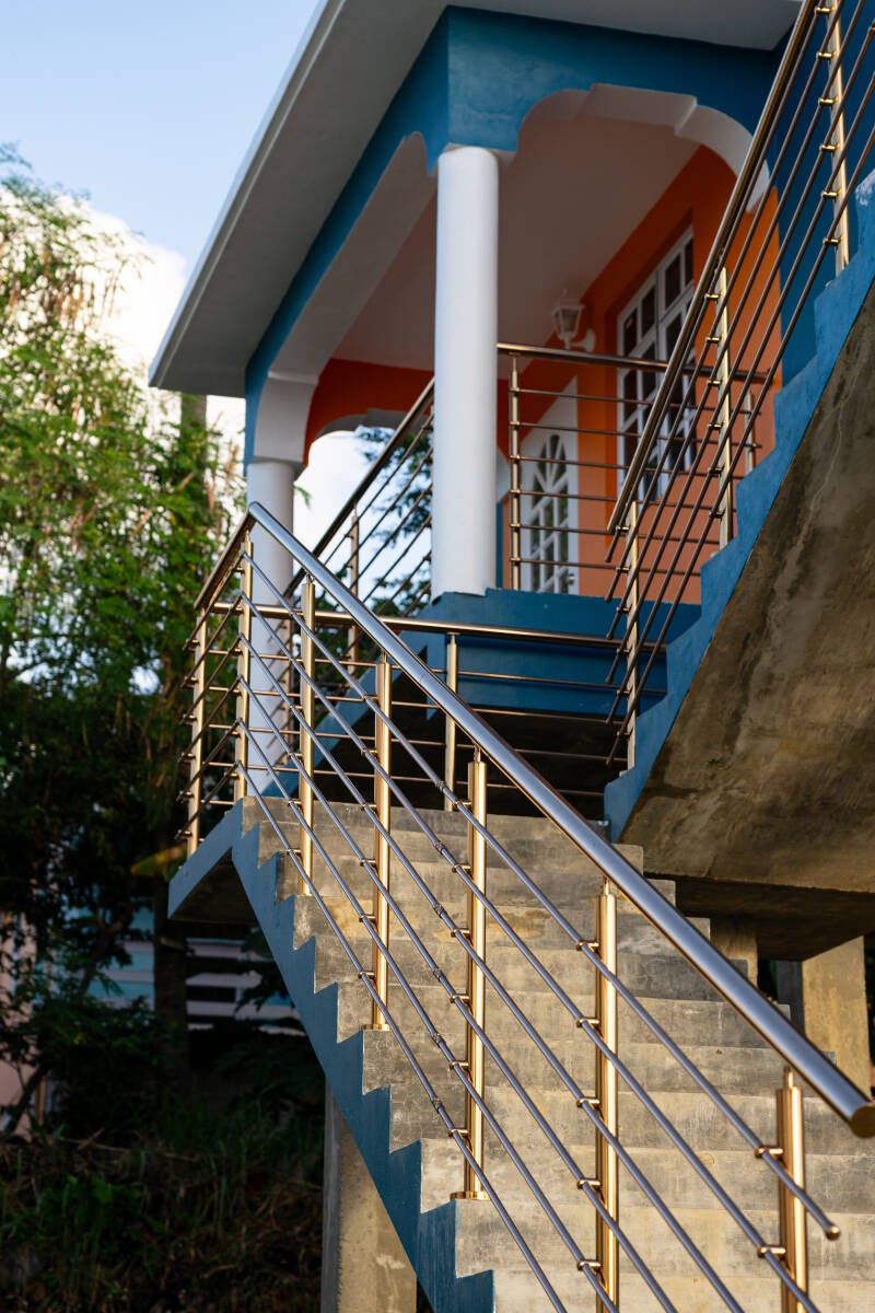 copper or rosegold tone stainless steel railings sourced and installed on house at Ciceron St Lucia by Progressive Welding Solutions Ltd