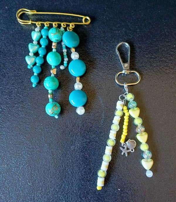 broche speld en tashanger