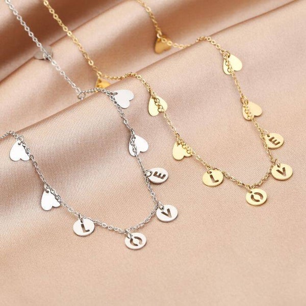 Vallende hartjes ketting LOVE Zilver