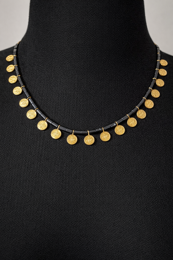 Luxe ketting met muntjes en hematiet