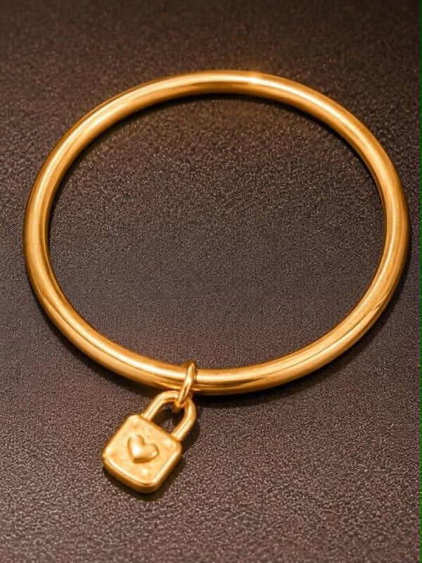 Goudkleurige Slavenarmband  met slotjein RVS