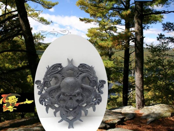 muurplaat doodshoofd met slangen 40 cm