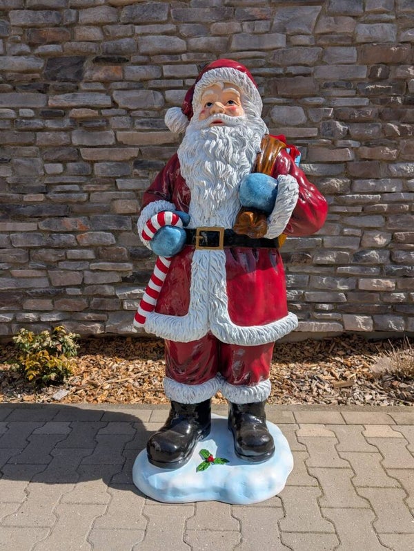 Kerstman staat met kerstlollie 72 x 70 x  145 cm