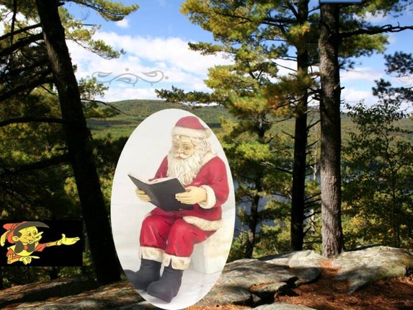 Curiosa Kerst man zit met boek polyester résine 120 cm