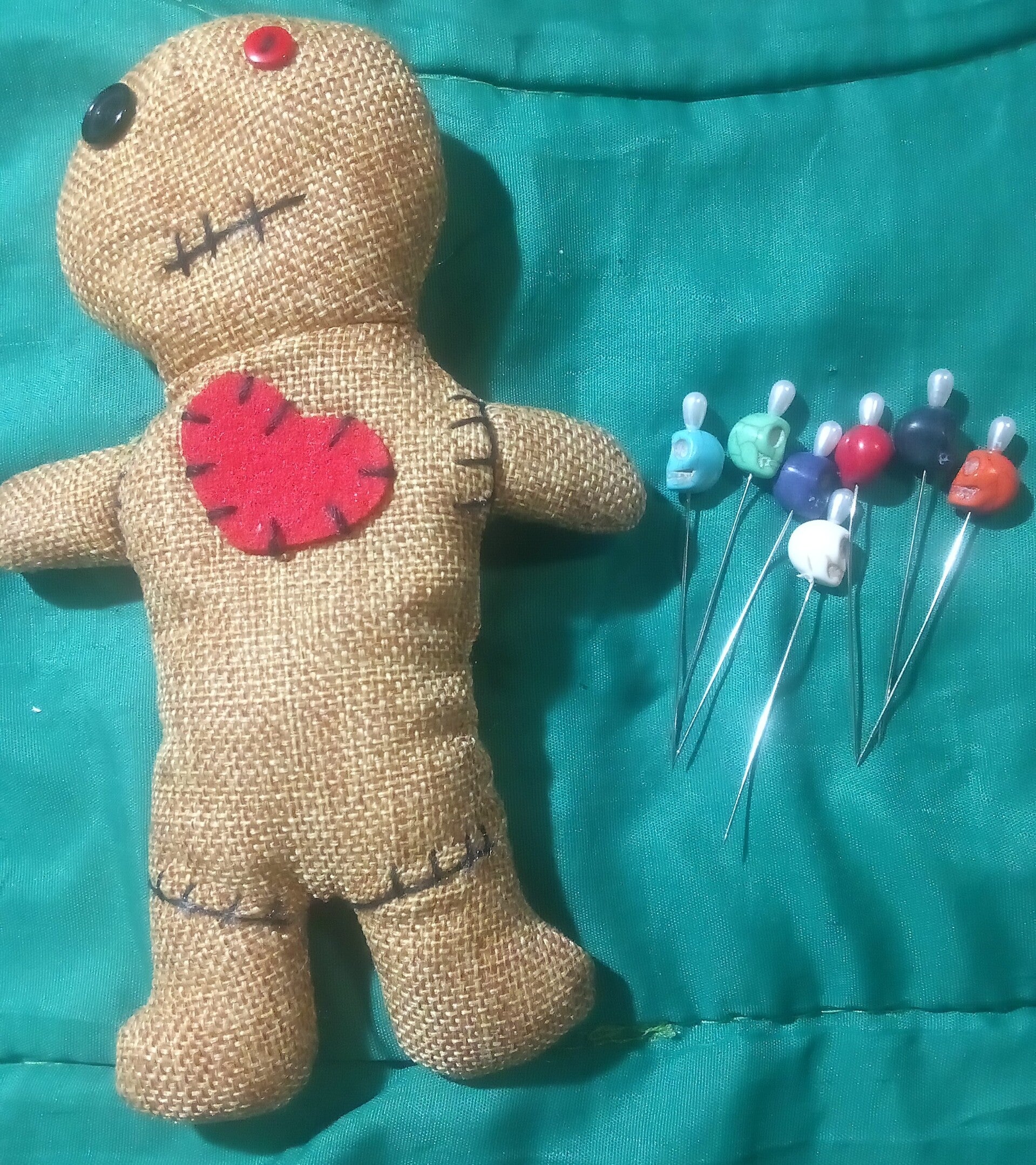 Traditional Revenge Voo Doo Doll with pins.