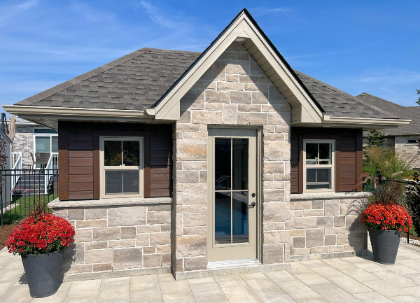 pool cabana with stone and siding, Woodstock