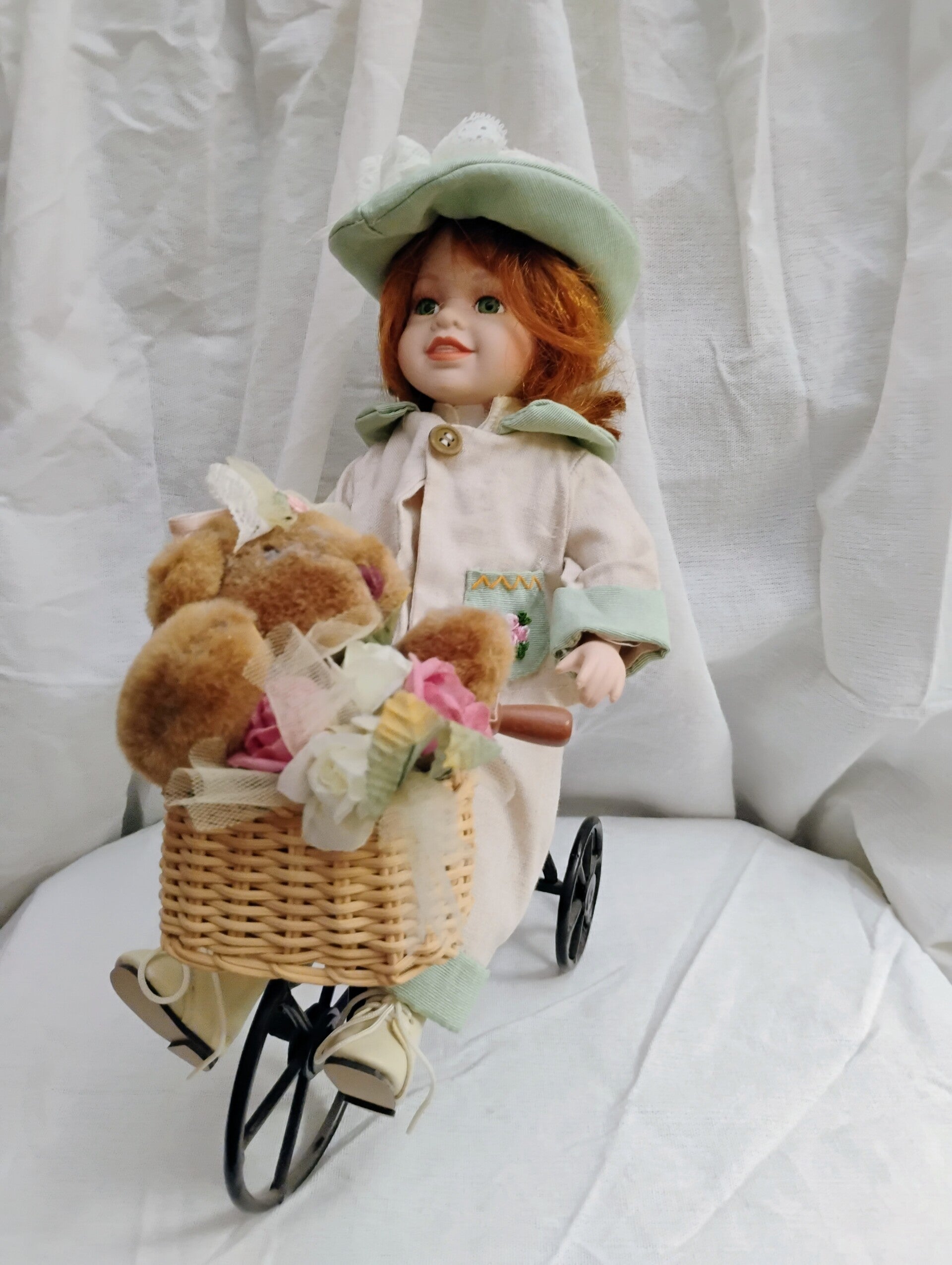 Vintage Porcelain Doll with Red Hair & Green Eyes – On Metal Tricycle with Teddy Bear & Floral Basket