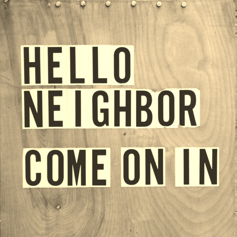 sign reading, "hello neighbor, come on in."
