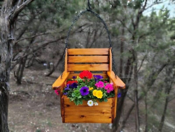 Little Boy Swinging Planter Chair