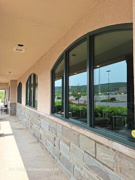 Residential arched window cleaning service for clear, streak-free finish by Pro Valley Renovations LLC.