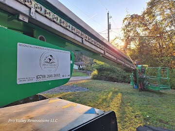 Commercial building exterior access and renovation work using lift equipment by Pro Valley Renovations LLC.