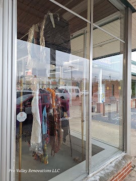 Retail storefront display window cleaning for improved visibility by Pro Valley Renovations LLC.