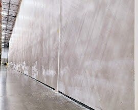 Industrial wall repair and surface preparation services in commercial facility by Pro Valley Renovations LLC.