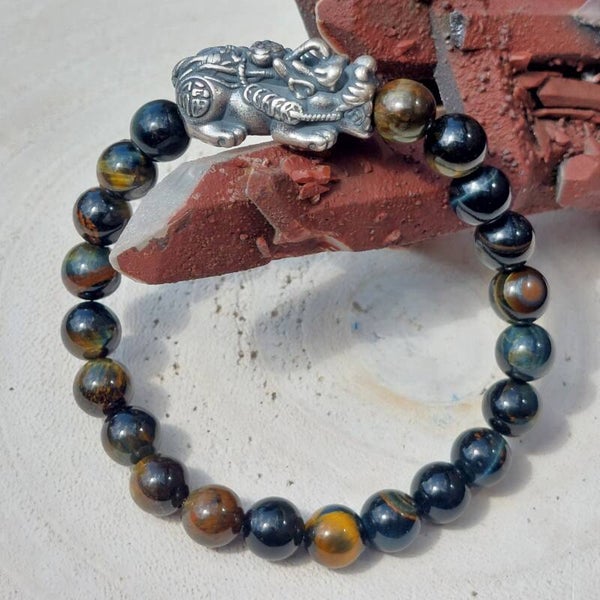 Tijgeroog met Valkenoog Armband 21x 8mm met zilveren 925 Bixie / Kylin bead van 2,6cm