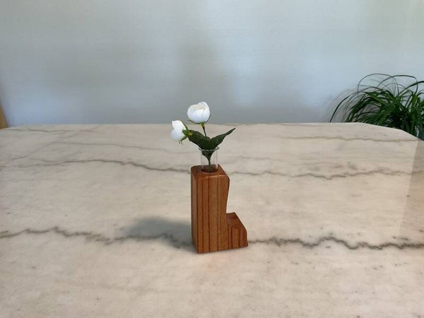Hand made wooden vase with glass tube.