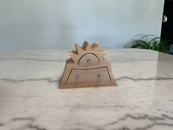 Star top band saw box with 2 drawers.