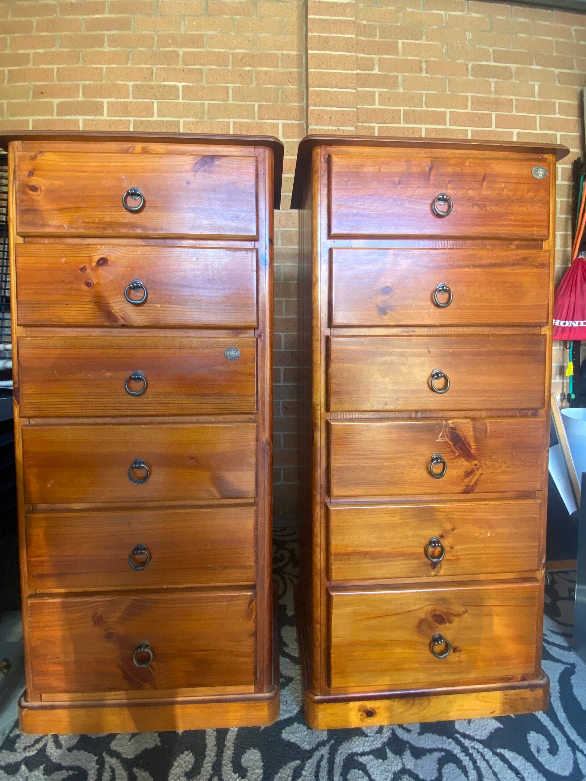 Two brown wooden tallboy dresser drawers