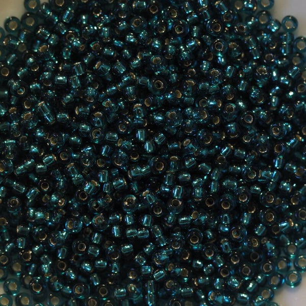 11/0-2425 Teal Transp. Silver Lined