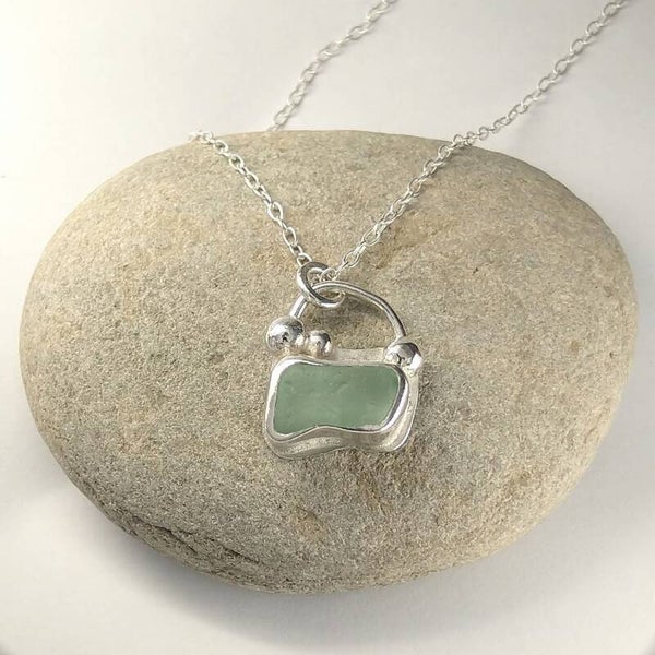 Light Blue Yorkshire Seaglass Silver pendant with mini pebbles.