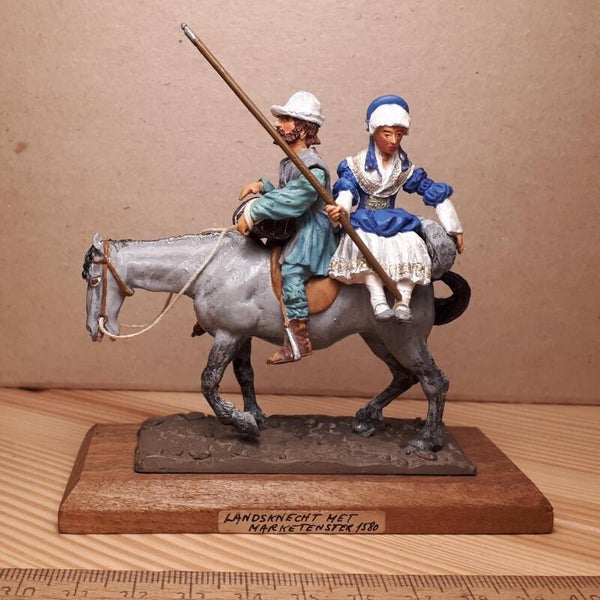 16th century off to market, man at arms & wife on mule