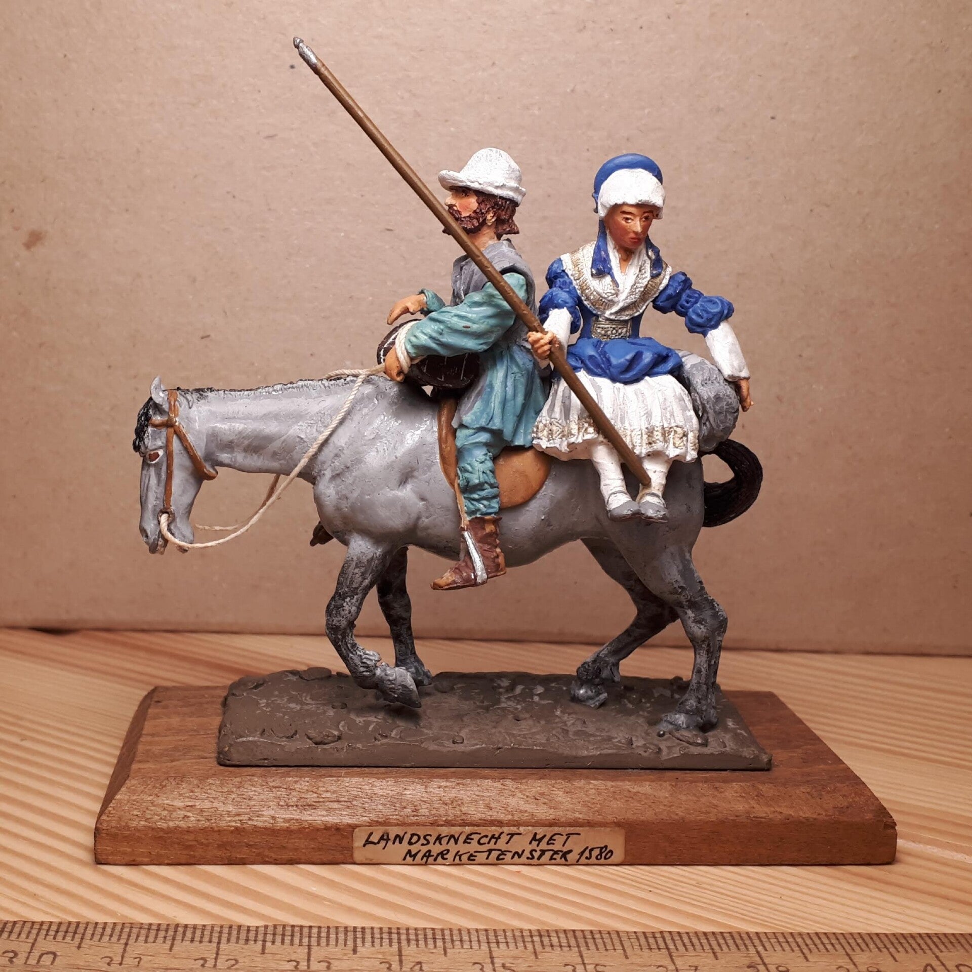 16th century off to market, man at arms & wife on mule