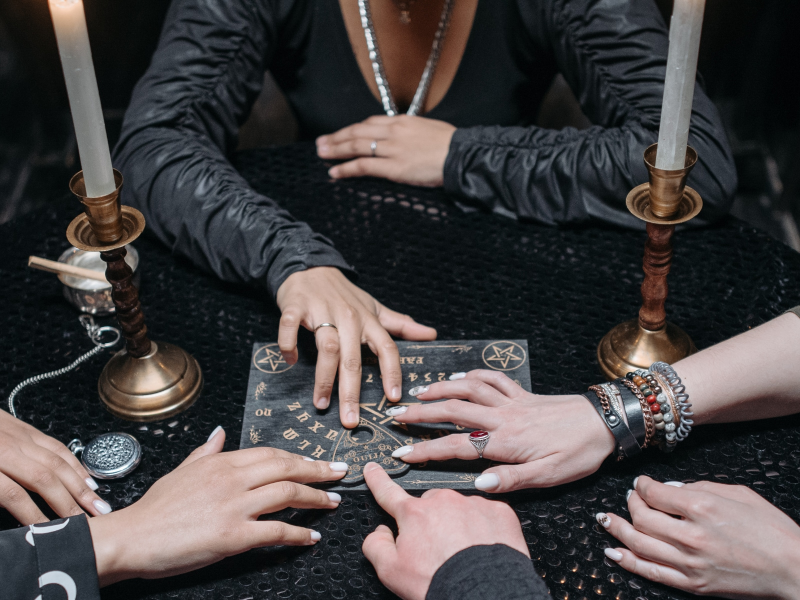 girls using ouija board