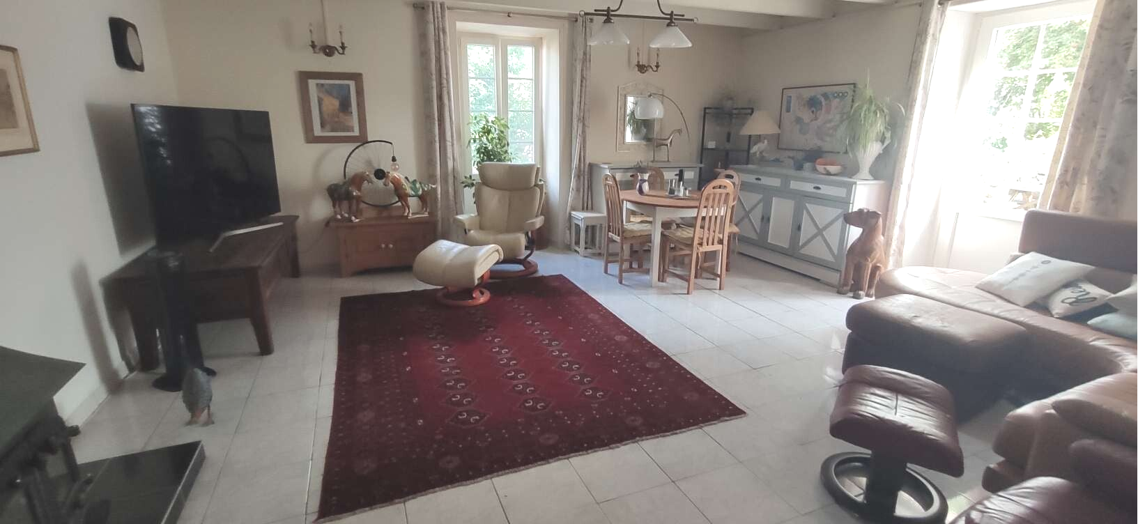 Filly tiled, cool and spacious double aspect living room