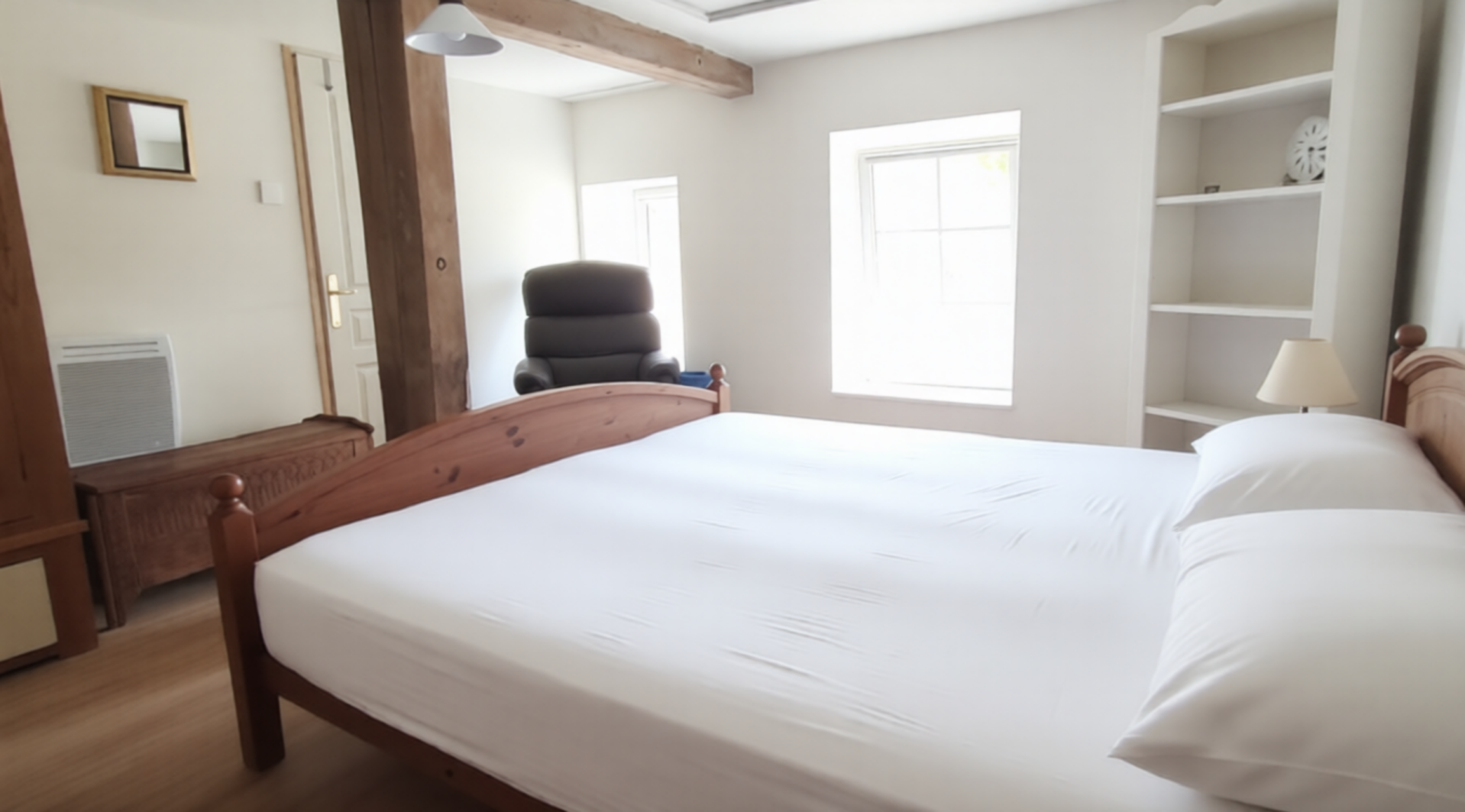 Newly modernised double bedroom with original beams and fireplace 