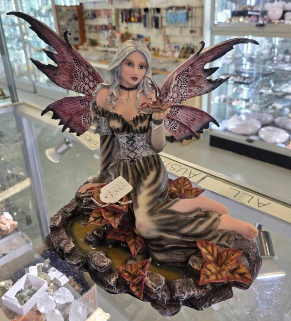Fairy holding Dragon