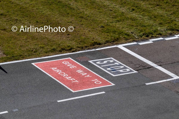 Airport vehicle stop markings on the apron at London Luton Airport UK 20-04-2025