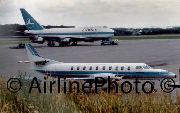 Embraer EMB-120RT Brasilia Luxair Commuter LX-LGM and Luxair Boeing 747 in background at Luxembourg Airport Belgium 28-08-1988