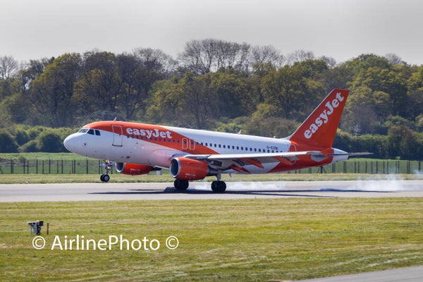 G-EZBI - Airbus A319-111 - easyJet landing with tyre smoke at London Luton Airport UK 20-04-2025