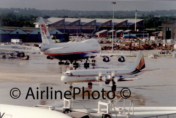 Lionair Boeing 747 and N667F Lockheed L-188C F Air Bridge Carriers on stand at Manchester Airport UK 05-08-1988