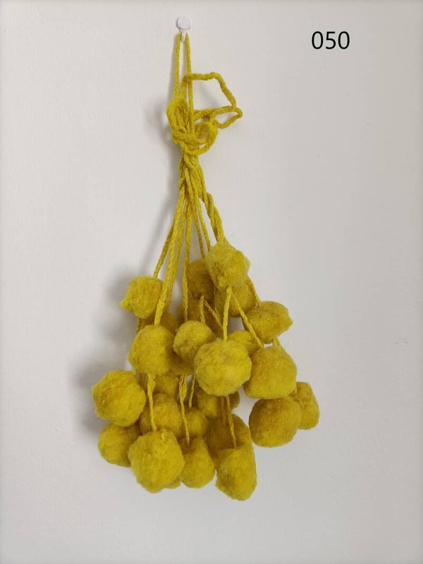 Pompones decorativos  realizadas con vellón de oveja por artesanas jujeñas.