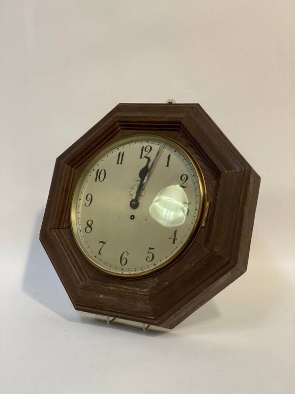Early 20th Century train wall clock with subsidiary seconds dial, complete with key.