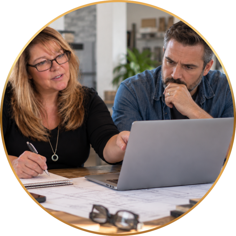 Small business owner reviewing marketing plans with a consultant